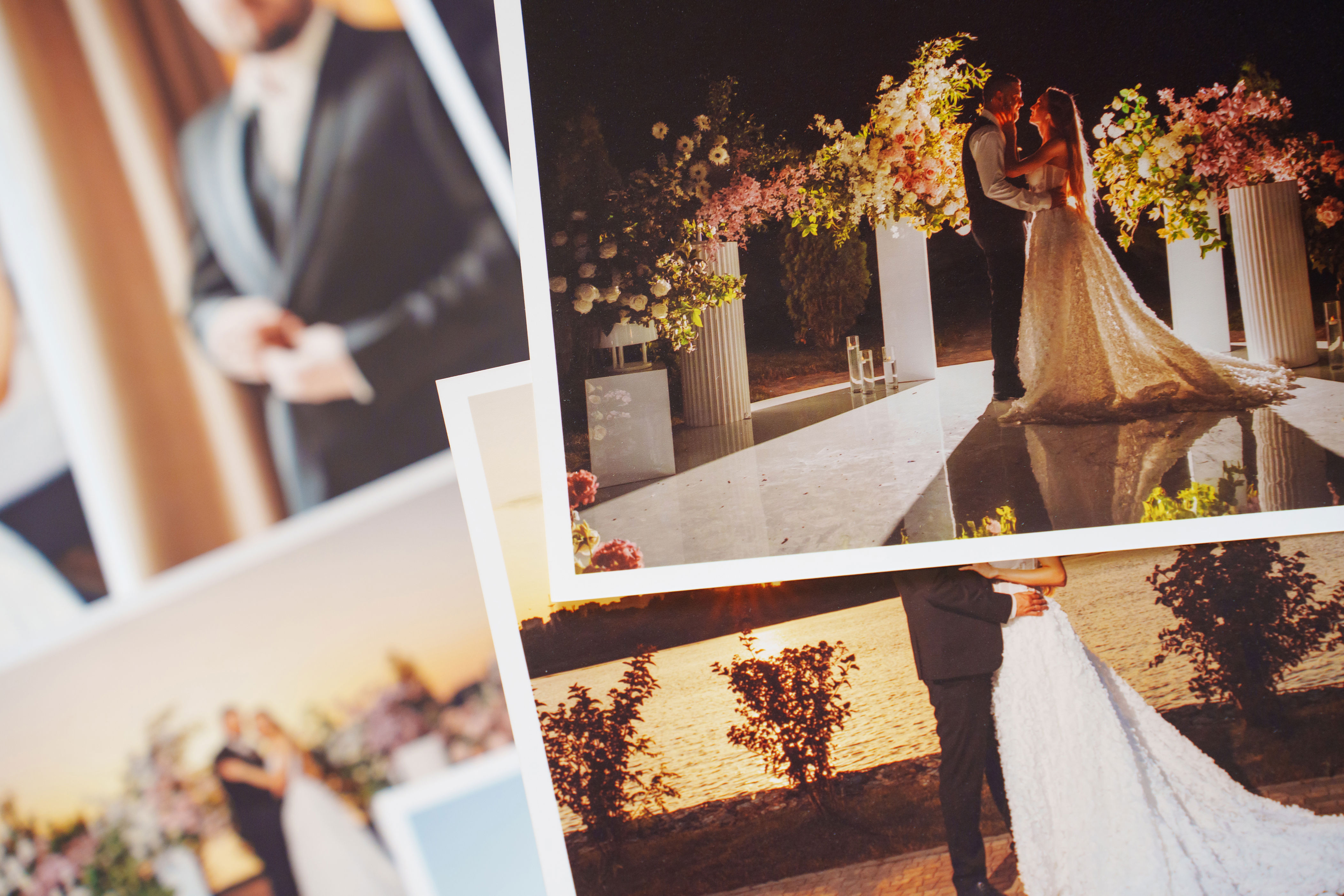 Collage of elegant wedding photos featuring a couple in formal attire under floral arrangements