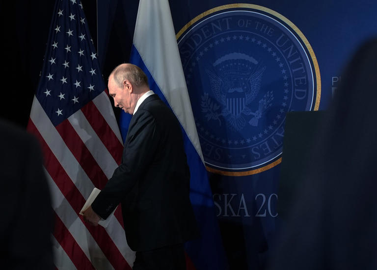 Russian President Vladimir Putin leaves the podium during an ill-fated summit with President Trump in Alaska.