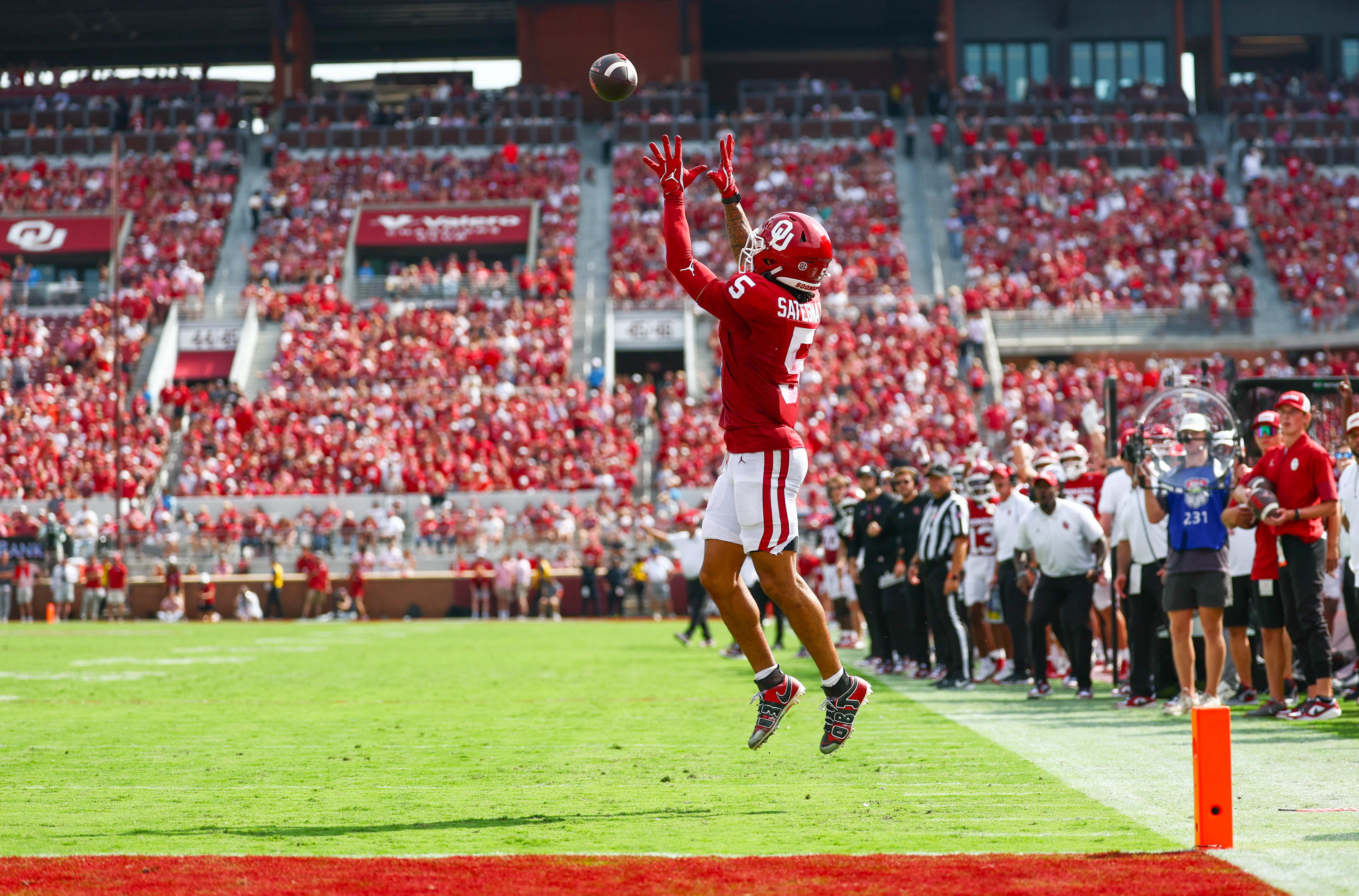 Sep 20, 2025; Norman, Oklahoma, USA; Oklahoma Sooners wide receiver Isaiah Sategna III (5) is left uncovered and catches a touchdown pass during the first half against the Auburn Tigers at Gaylord Family-Oklahoma Memorial Stadium. Mandatory Credit: Kevin Jairaj-Imagn Images
