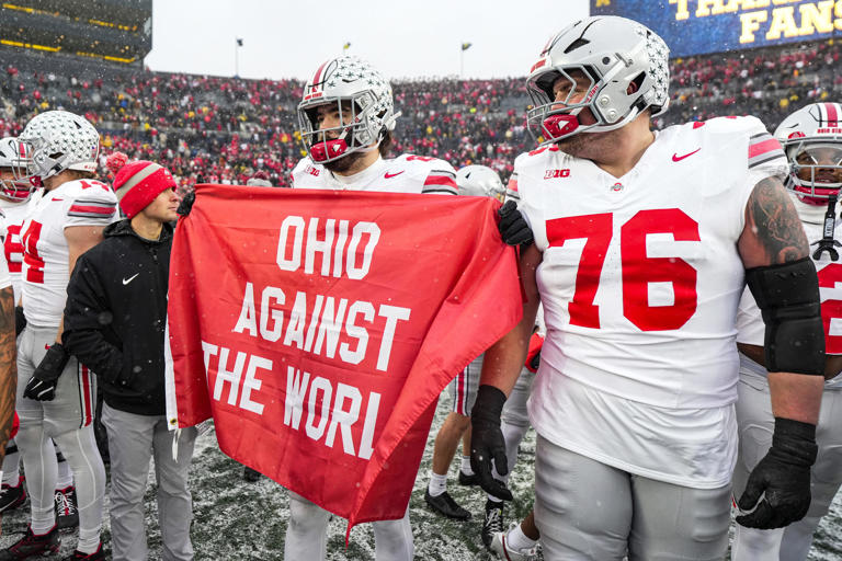 Michigan protects logo as OSU players hint at flag-planting after win