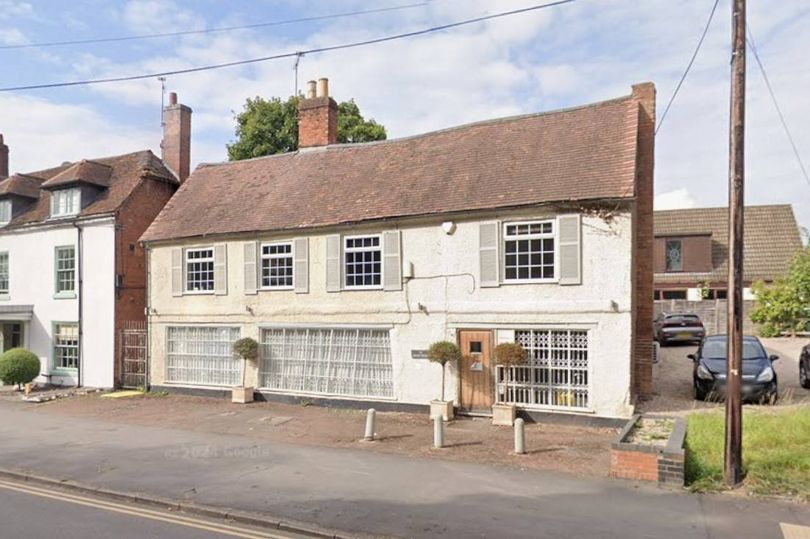 Plans to convert empty 18th century village building into four homes