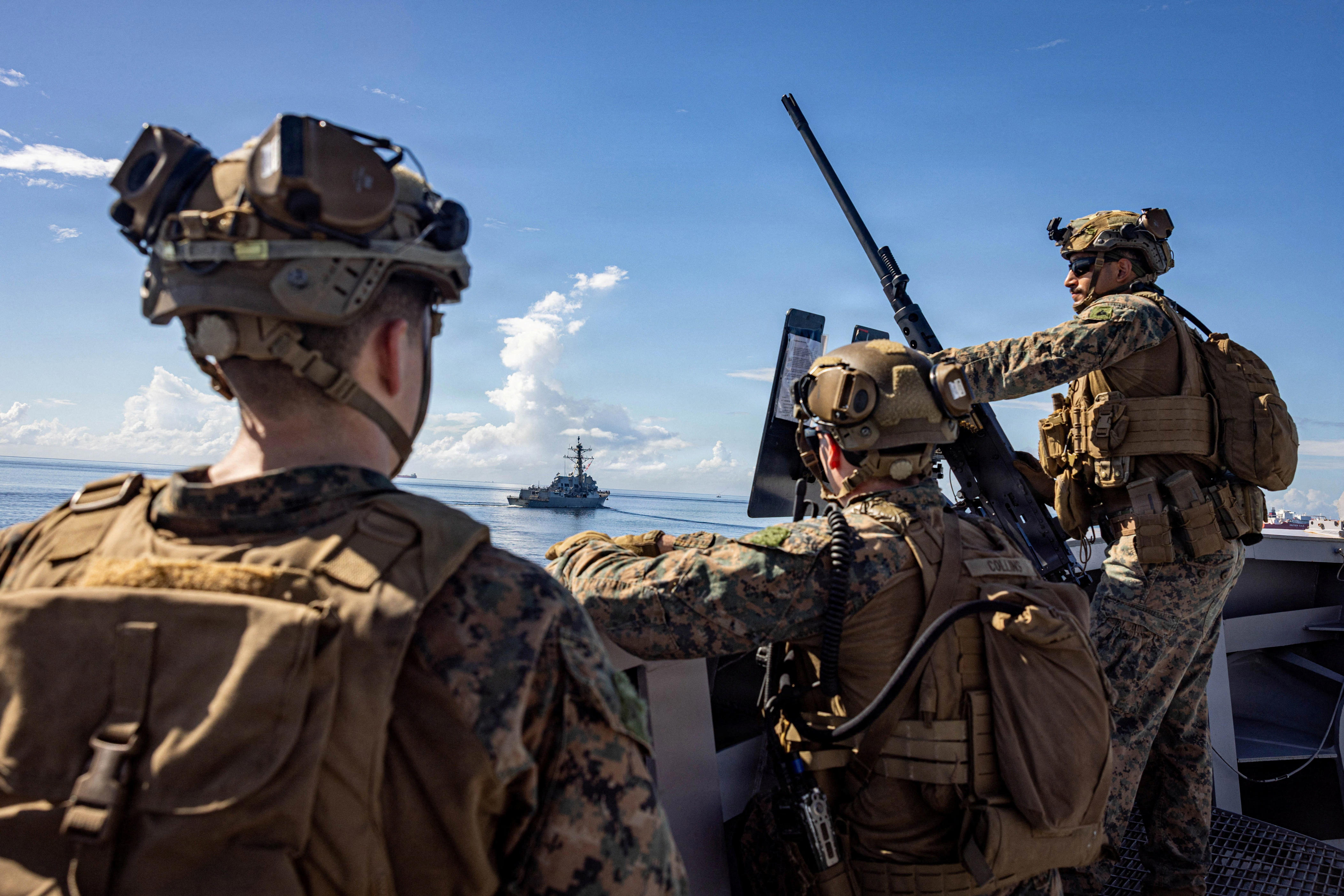U.S. Marines keep watch during a strait transit while underway in the Caribbean Sea, November 18, 2025. Sgt. Nathan Mitchell/U.S. Marine Corps/Handout via REUTERS THIS IMAGE HAS BEEN SUPPLIED BY A THIRD PARTY