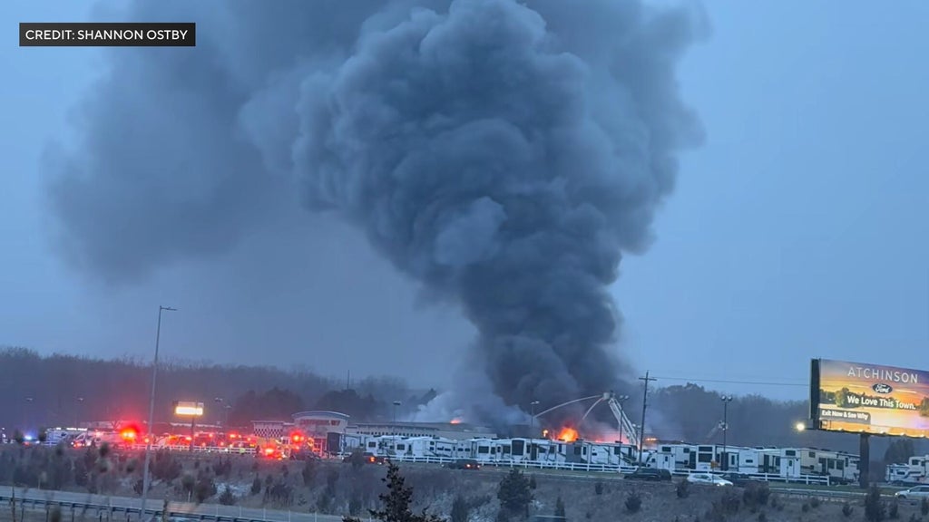 Crews battle large fire at recreational vehicle dealership in Belleville
