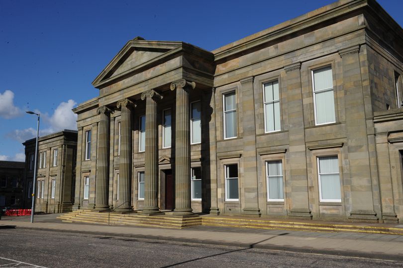 Thug who spat blood on partner's face is jailed
