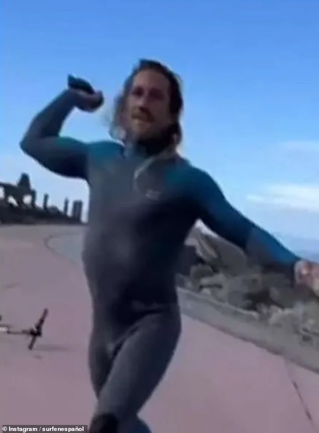 Moment Tenerife surfer hurls rocks at tourists after punching one for ...