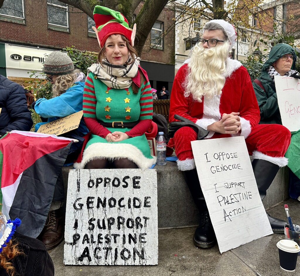 Police arrest ‘Santa’ and drag him through busy city centre