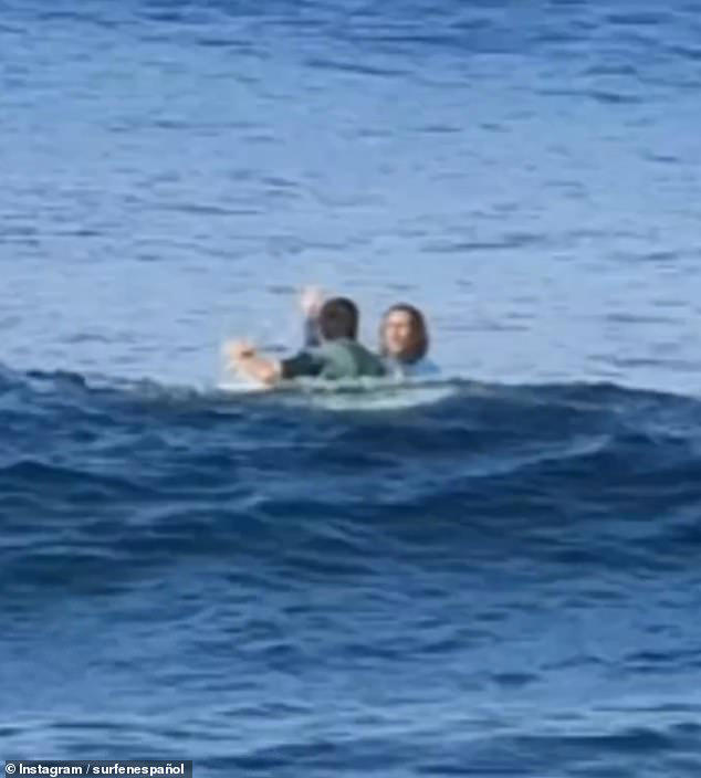 Moment Tenerife surfer hurls rocks at tourists after punching one for ...