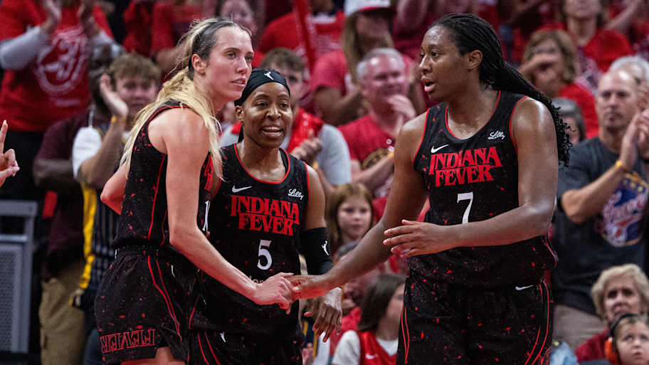 Sep 28, 2025; Indianapolis, Indiana, USA; Indiana Fever forward Aliyah Boston (7) celebrates a made basket with guard Lexie Hull (10) in the second half during game four against the Las Vegas Aces of the second round for the 2025 WNBA Playoffs at Gainbridge Fieldhouse. Mandatory Credit: Trevor Ruszkowski-Imagn Images | Trevor Ruszkowski-Imagn Images