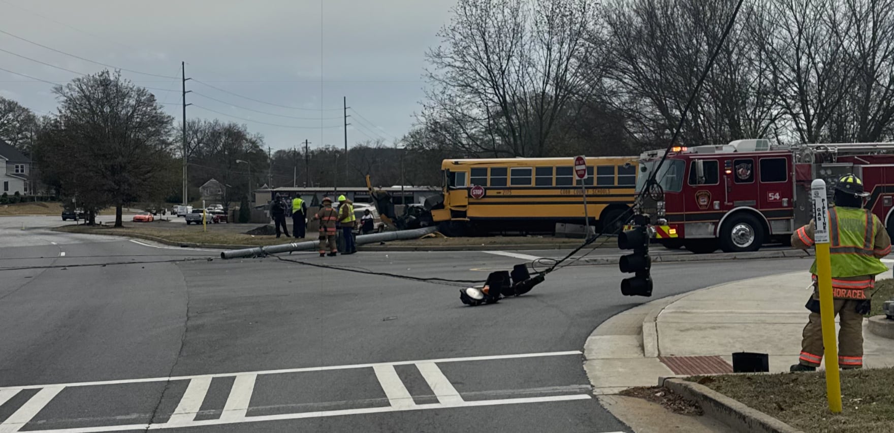 Cobb County school bus crashes into utility pole, taking down traffic ...