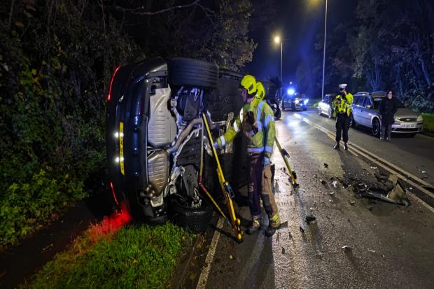 A27 closed off by police as car flips over in serious crash