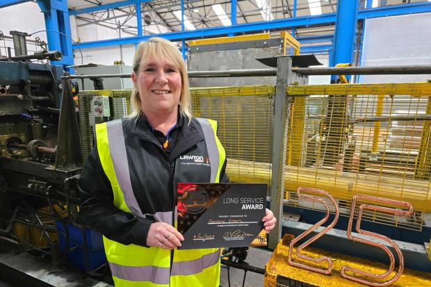 Poole professional reaches career milestone with employer