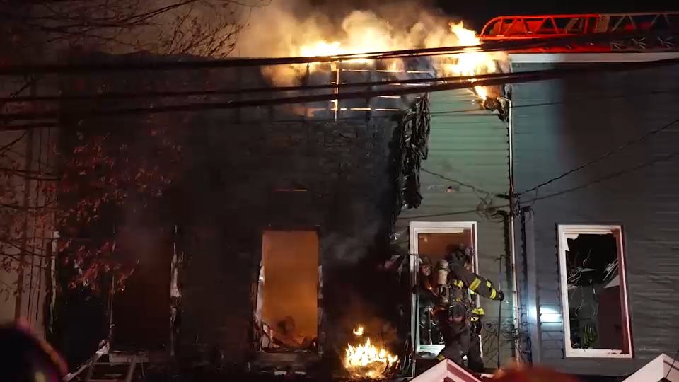 Firefighter, resident injured after 5-alarm fire tears through four ...