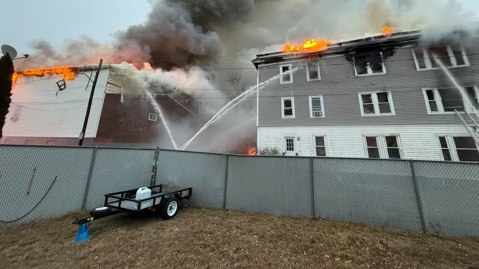 Massive emergency response as fire spreads to multiple buildings in ...