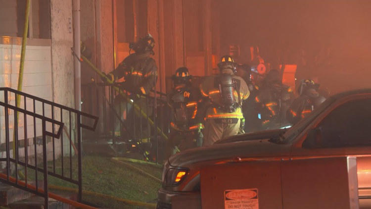 Firefighter falls through floor as crews battle fierce three-alarm fire ...