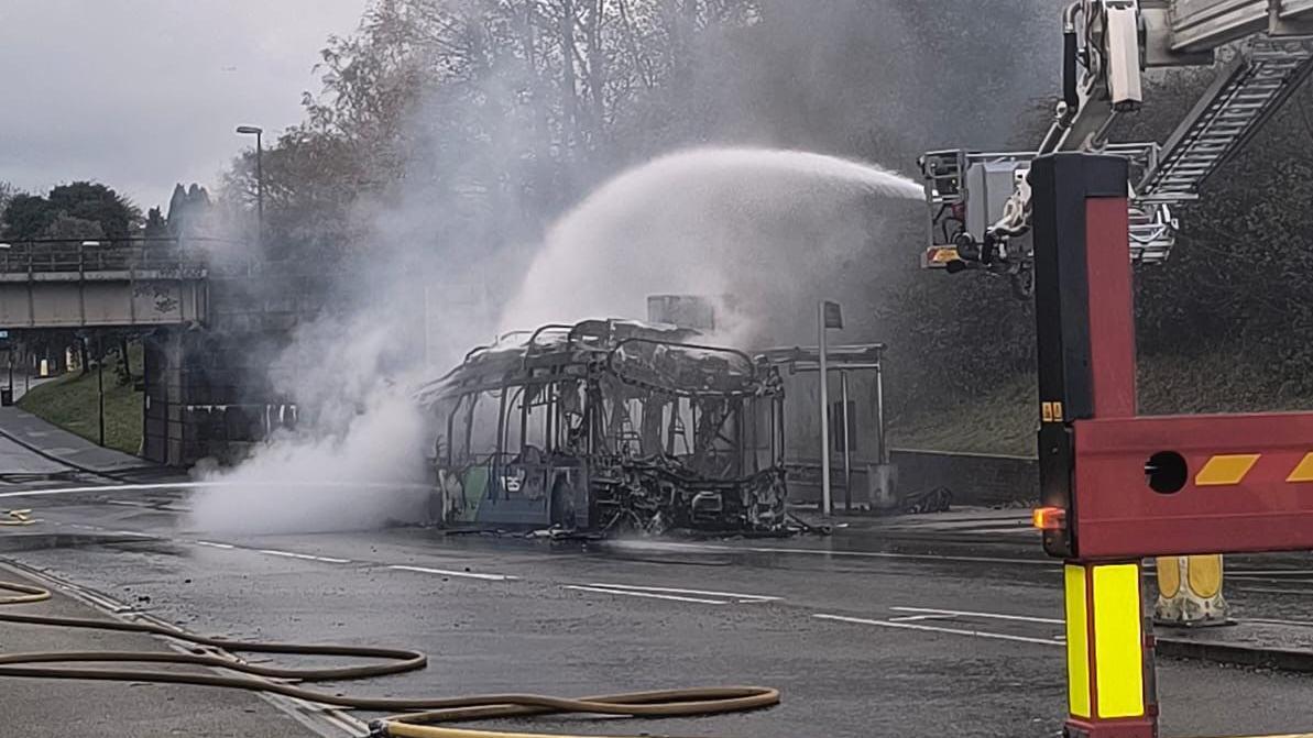 Roads closed in Crawley after fire destroys bus