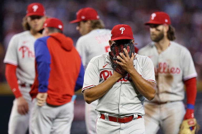 Ranger Suarez #55 of the Philadelphia Phillies reacts as he walks back to the dugout after being relieved against the Arizona Diamondbacks during the sixth inning in Game Three of the National League Championship Series at Chase Field on October 19, 2023 in Phoenix, Arizona.