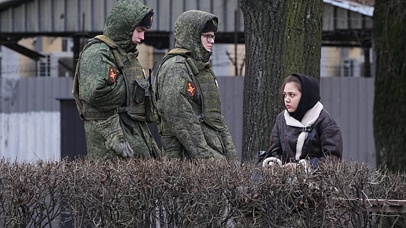 Soldiers patrol an area around an office for recruitment for contract service in the Russian armed forces in St. Petersburg, Russia, Tuesday, Dec. 2, 2025.