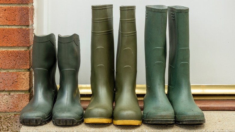 Don't toss old rain boots - they make the perfect umbrella storage solution