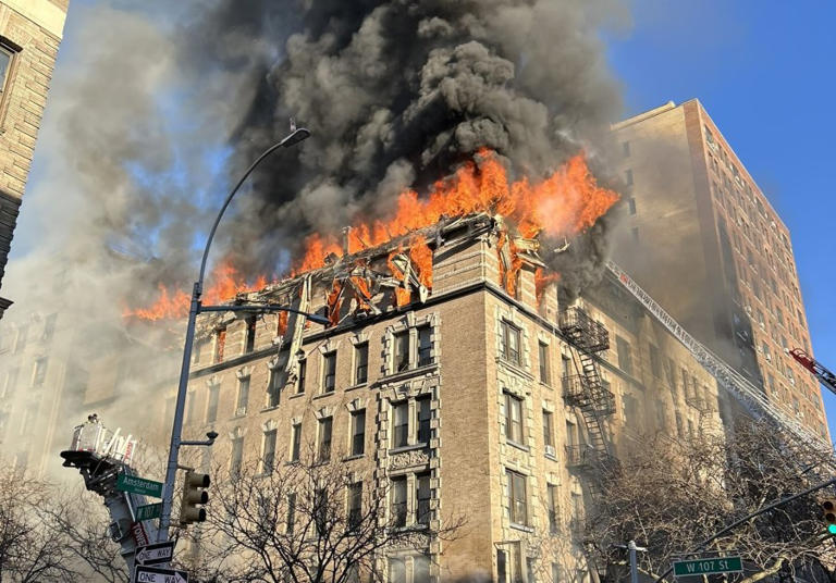 Fire shoots out of NYC apartment building windows