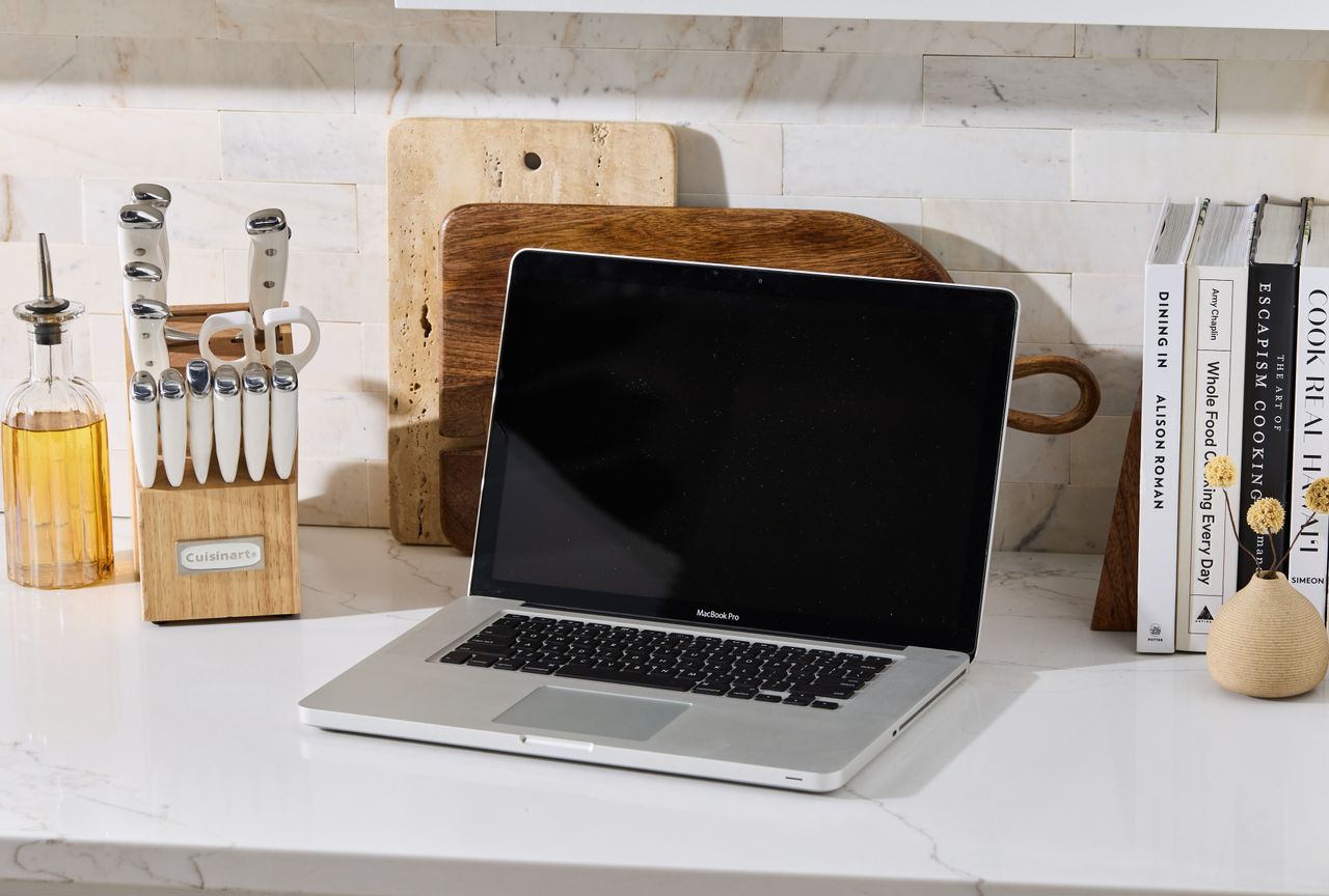 Laptop on kitchen countertop