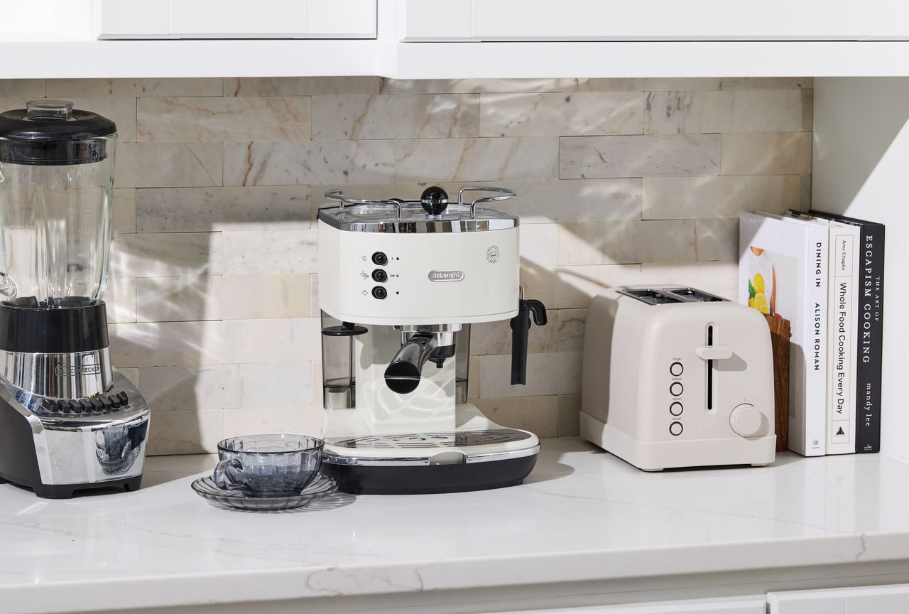 Many appliances on kitchen countertop