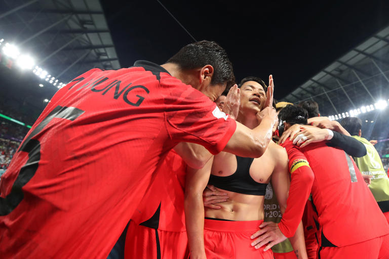Korea’s Hwang Hee-chan celebrates with teammates at the 2022 World Cup against Portugal (Getty)