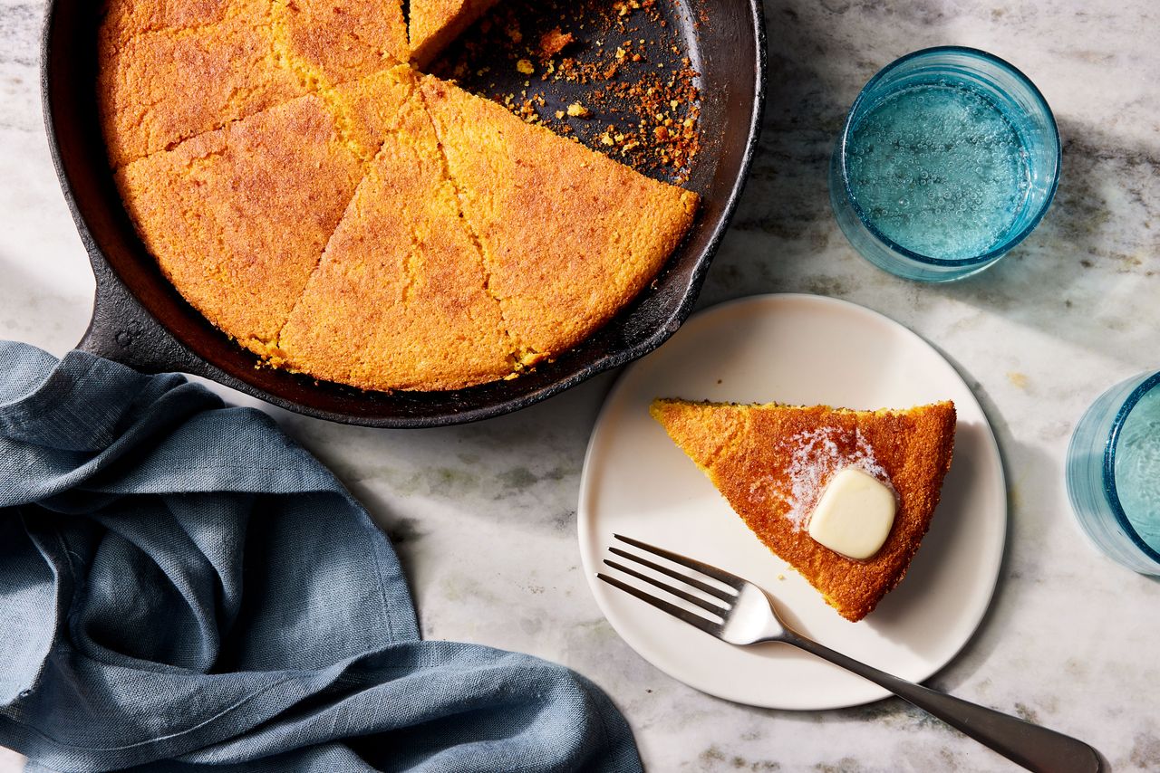 Southern Living Skillet Cornbread sliced to serve with butter