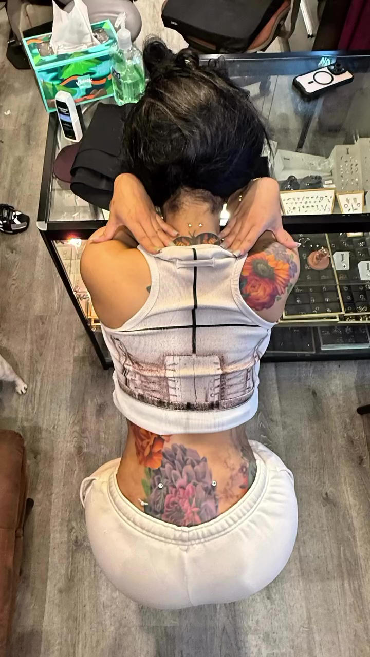 Cardi B shows off her new neck and back piercings in second-skin ...