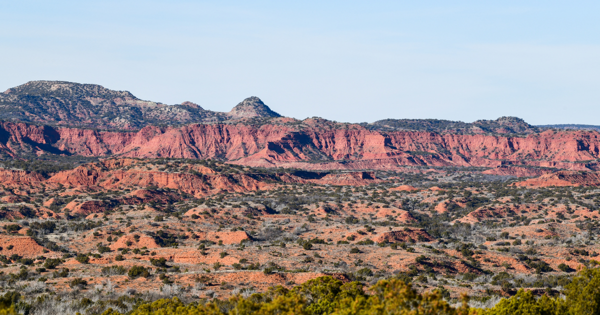 Striking red rock cliffs and rugged desert landscape at Caprock Canyons State Park.