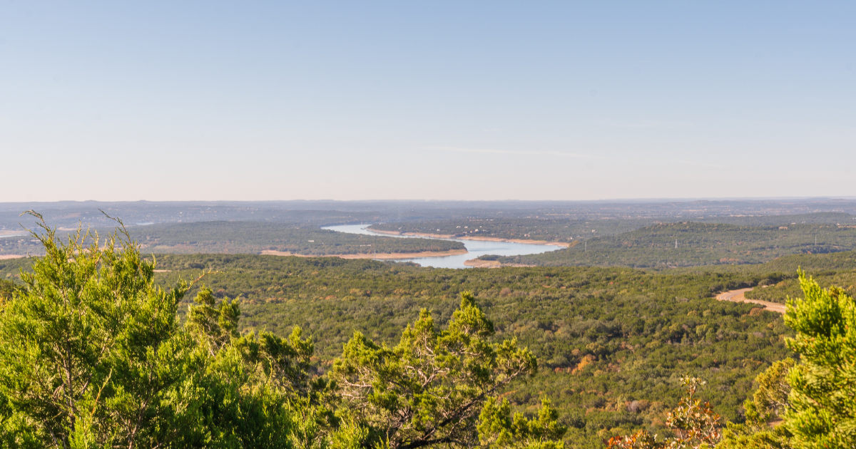 Hill Country overlook with sweeping views of a winding lake at Balcones Canyonlands National Wildlife Refuge, highlighting it as one of the must visit places in Texas for scenic hiking.