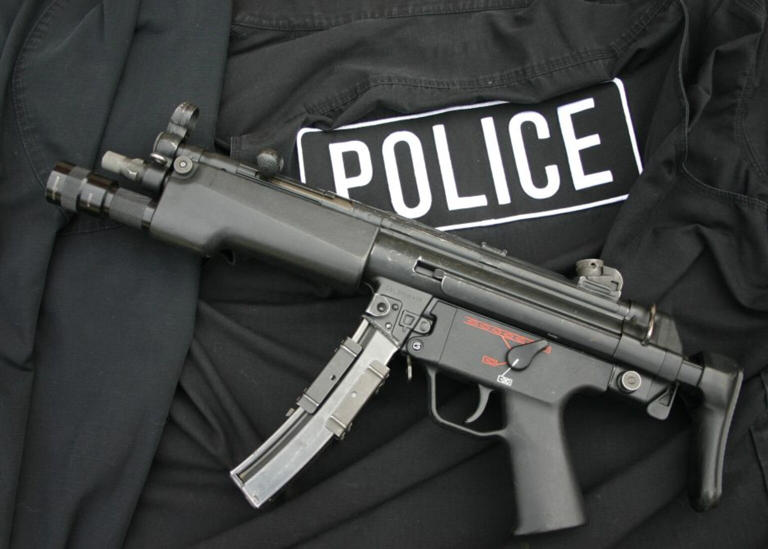 Deadly submachine gun found in searches linked to theft from PSNI ...