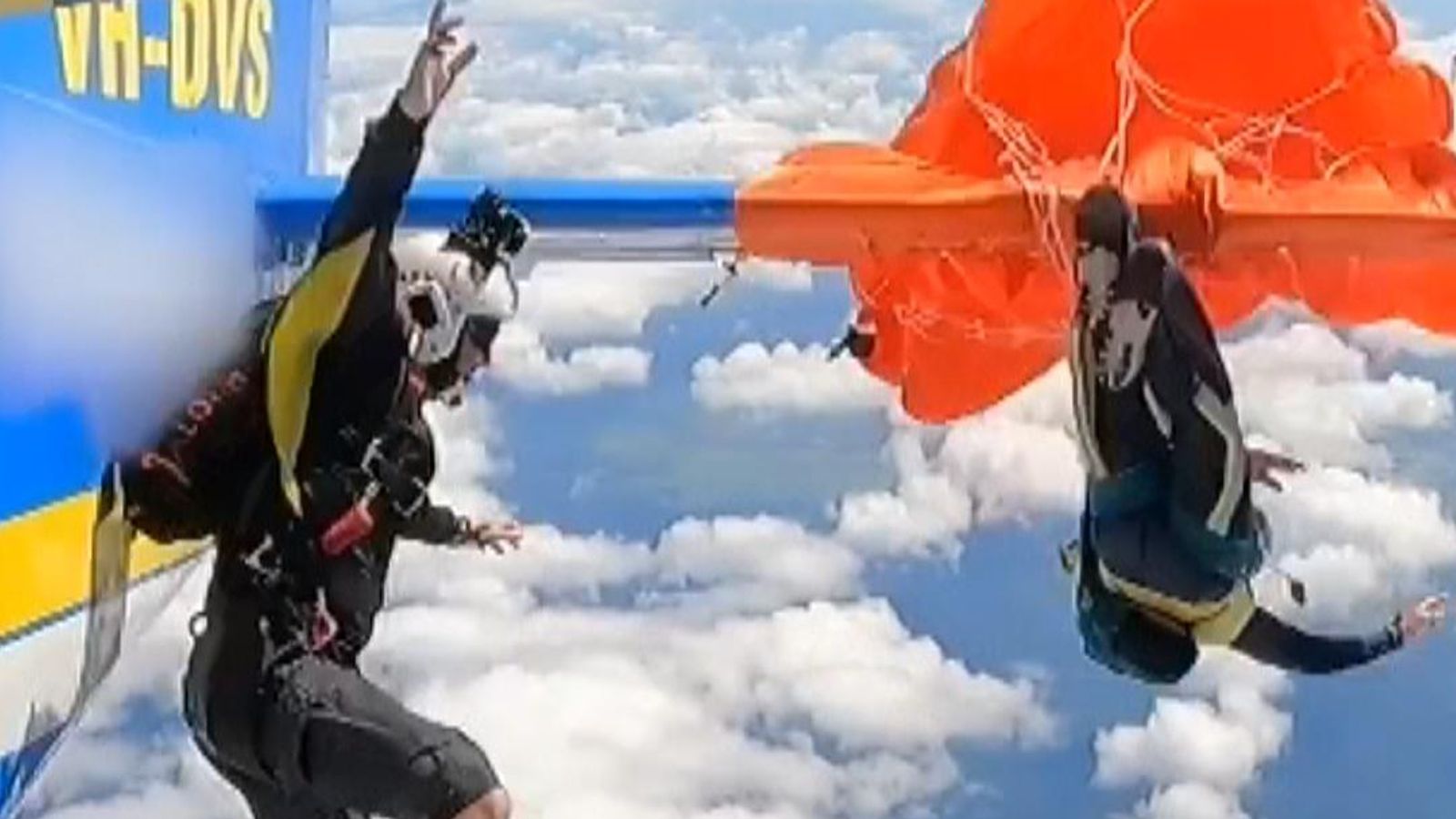 Terrifying moment parachute gets stuck on plane