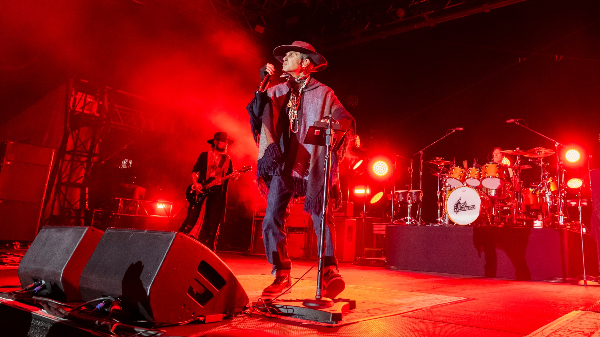 Rock frontman 'truly sorry' after on-stage punch up
