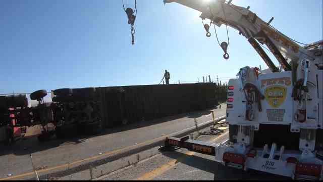 Using a 75ton rotator to upright a tractor trailer