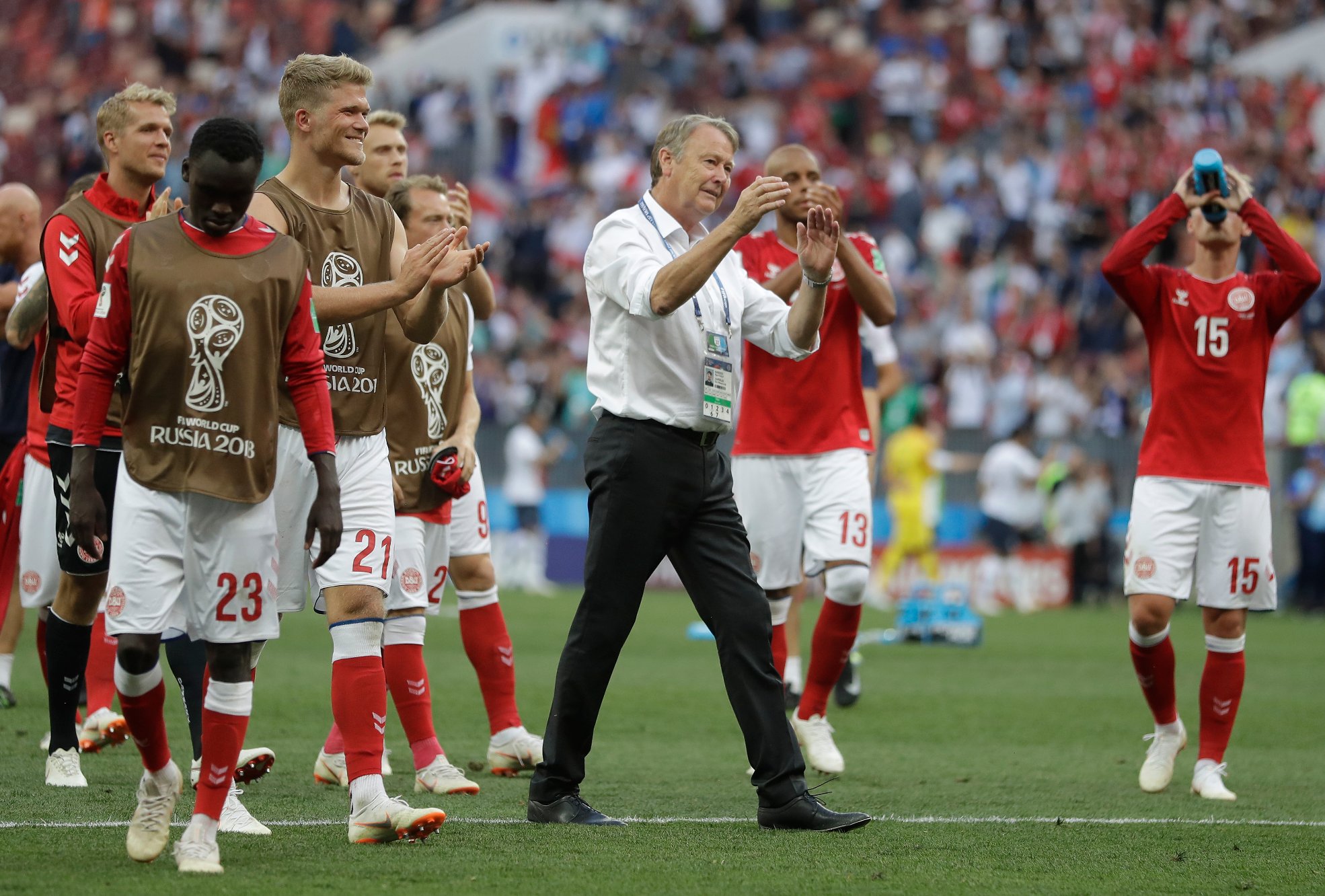 Denmark head coach Age Hareide, centre applauds his teams fans after the end of the group C match between Denmark and France at the 2018 soccer World Cup at the Luzhniki Stadium in Moscow, Russia, Tuesday, June 26, 2018. The game ended in a 0-0 draw. (AP Photo/Matthias Schrader)