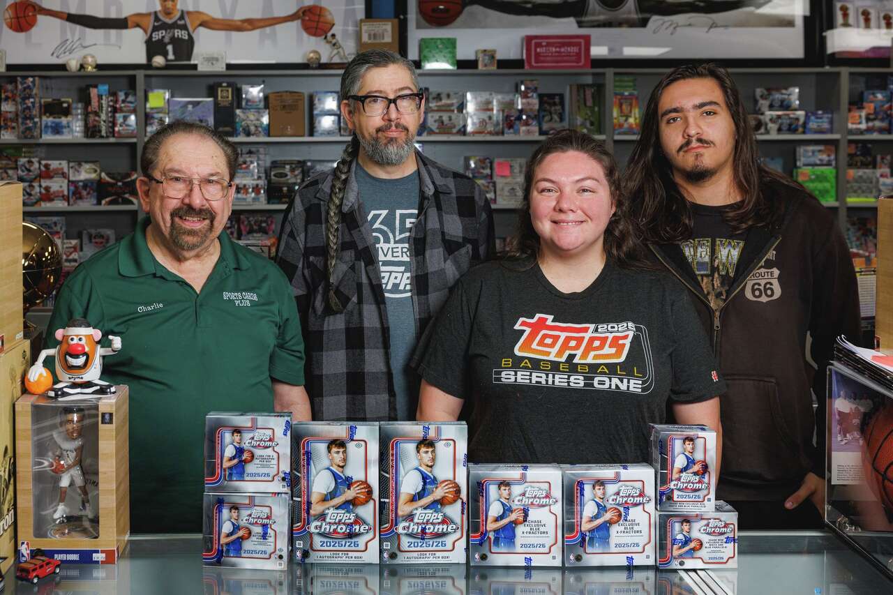 Sports Cards Plus owner Charlie DiPietro, from left, stands with his son Jeff and grandchildren Elizabeth and Jordan, who all work alongside him at his sports card and memorabilia store at 2251 Lockhill Selma Road. The elder DiPietro has been in the collectible cards business for more than 30 years. (Sam Owens/San Antonio Express-News)