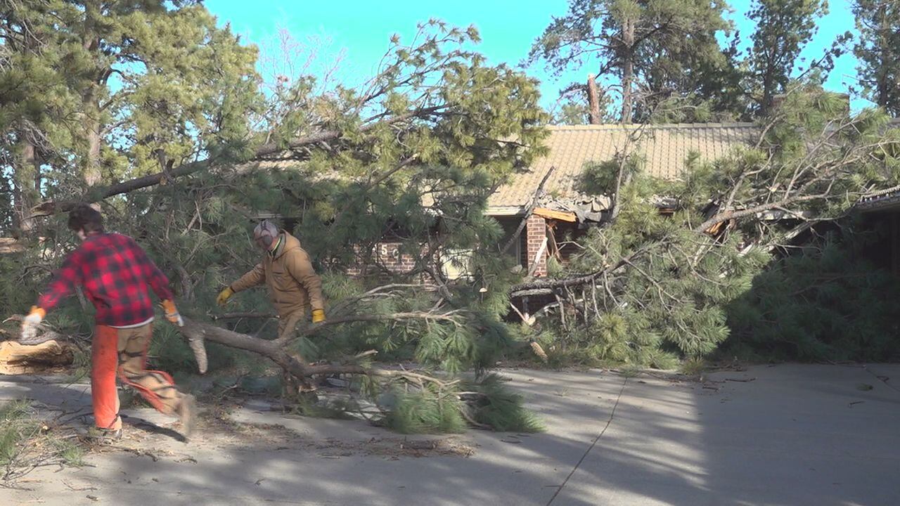 Rapid City family helps neighbor clear out house debris in windstorm ...