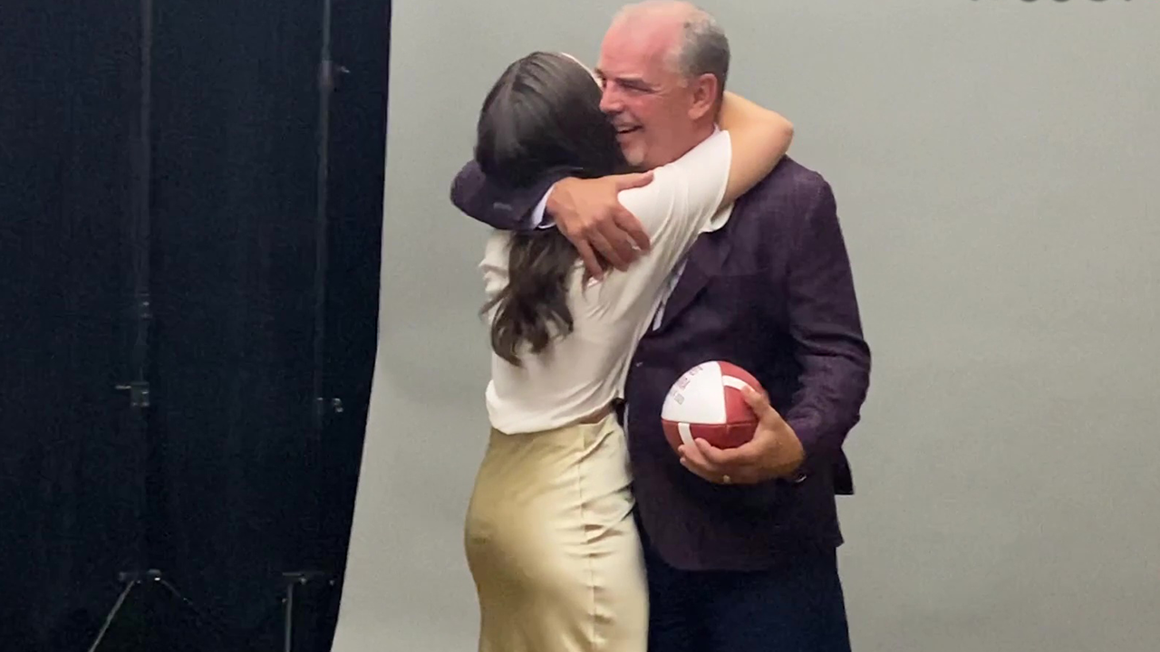 Daughter surprises dad by appearing alongside him in his football Hall ...