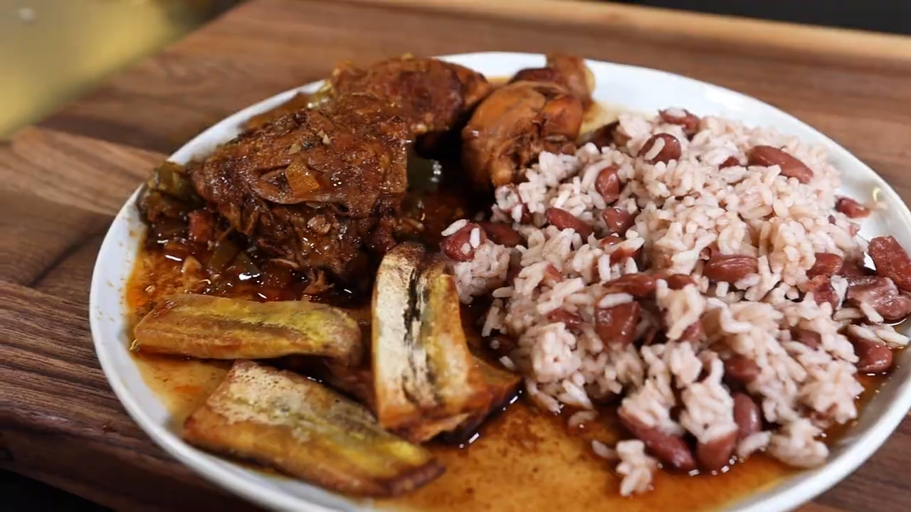 Easy stewed chicken with rice and beans and fried plantains