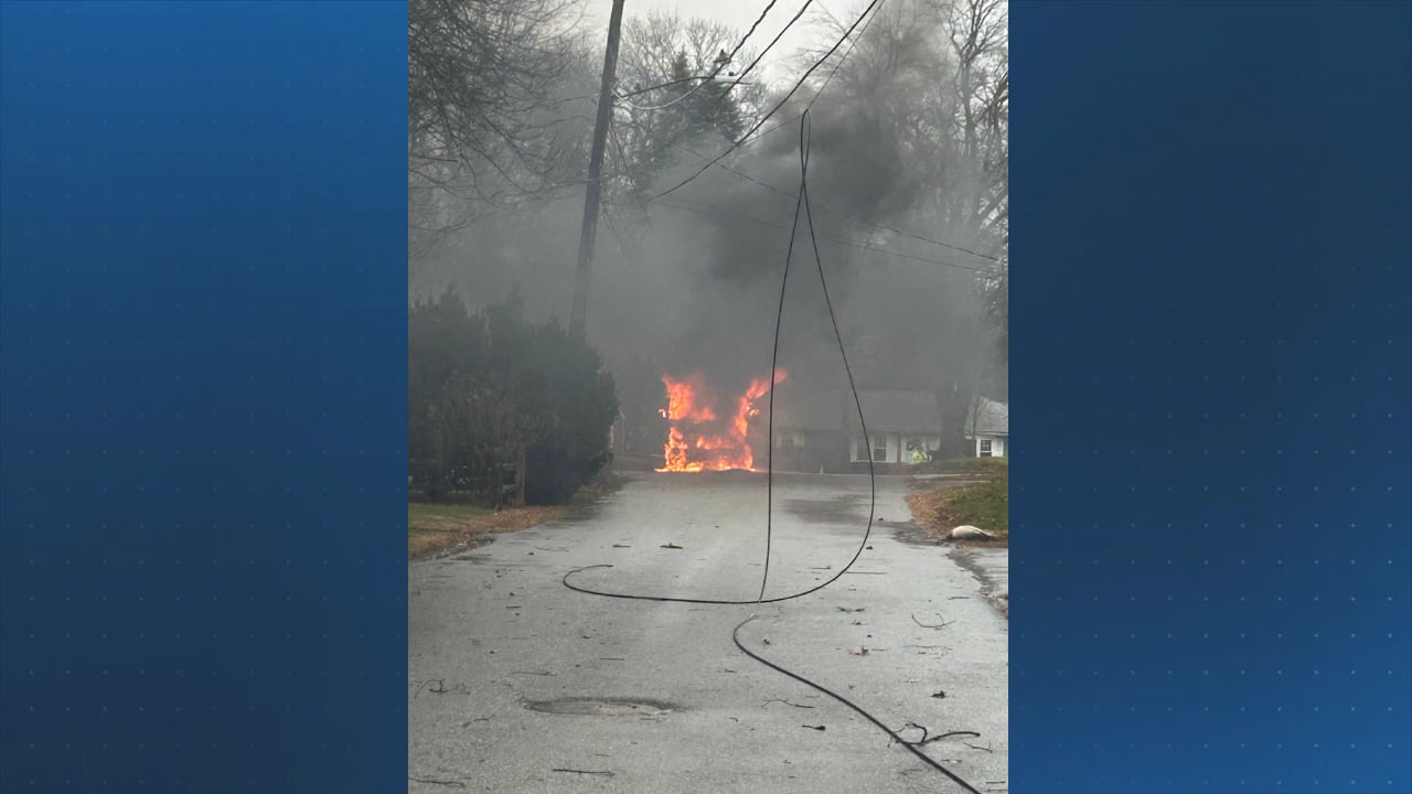Vehicle catches fire after wind brings down power lines in Framingham