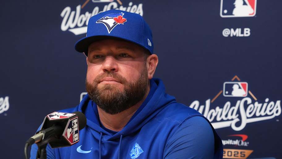 Oct 28, 2025; Los Angeles, California, USA; Toronto Blue Jays manager John Schneider (14) speaks in a press conference before game four of the 2025 MLB World Series against the Los Angeles Dodgers at Dodger Stadium. | Kirby Lee-Imagn Images