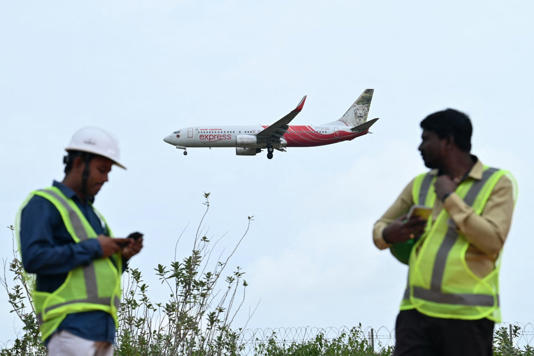 An Air India Express aircraft prepares to land at Kempegowda International Airport in Bengaluru