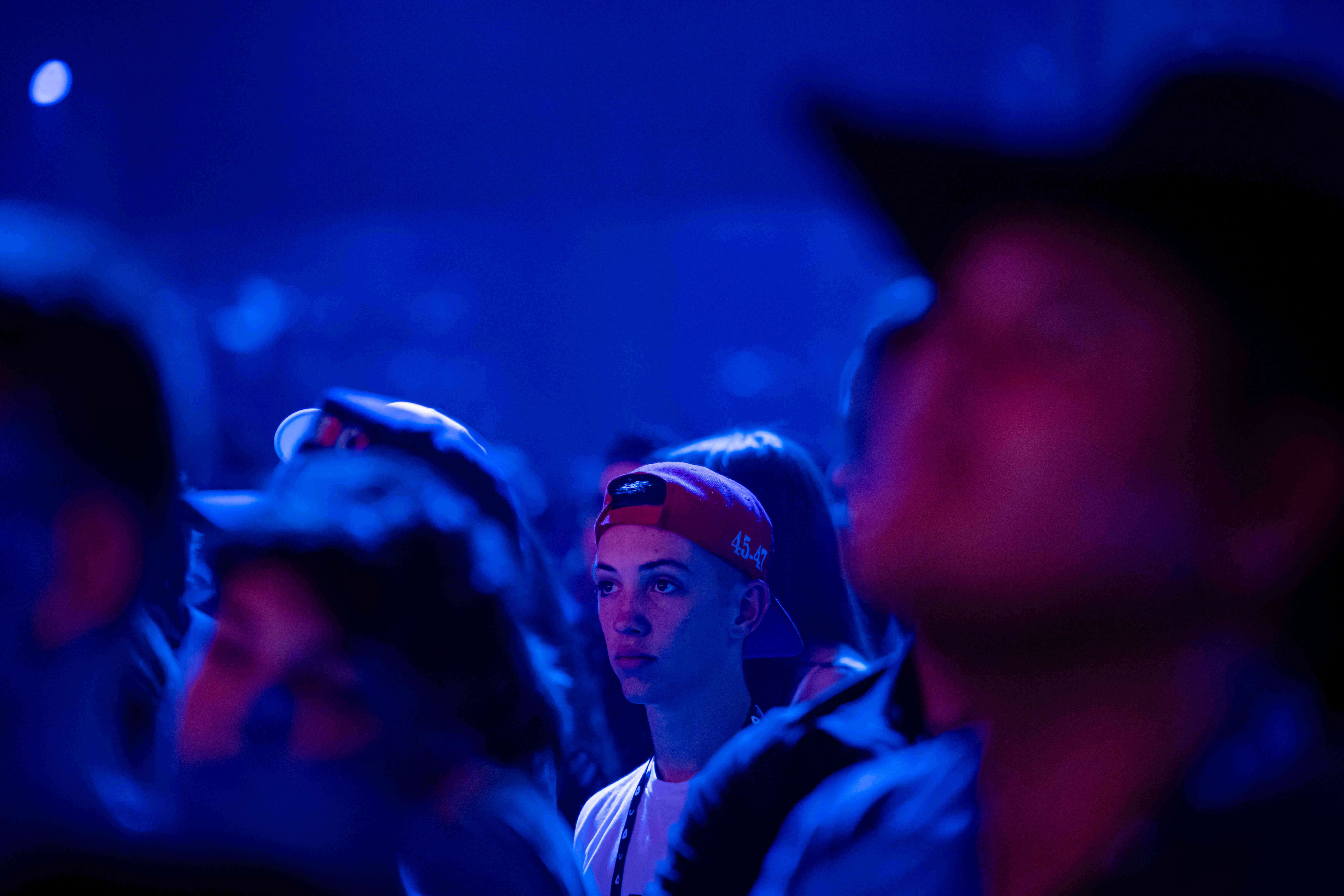 An attendee looks on during Turning Point USA's AmericaFest 2025 on Thursdayin Phoenix.