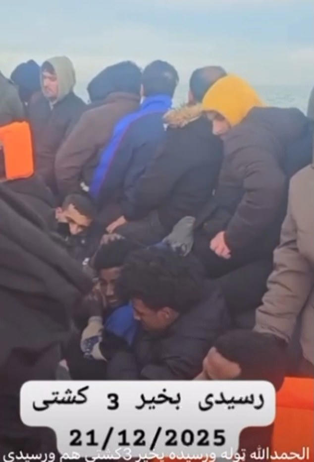 Moment migrants use Nike trainers to bail out their sinking dinghy as ...
