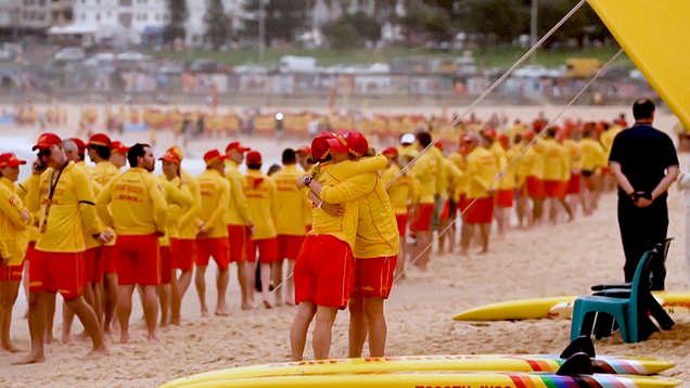Grieving Australian lifeguards line Bondi Beach at vigil after ...