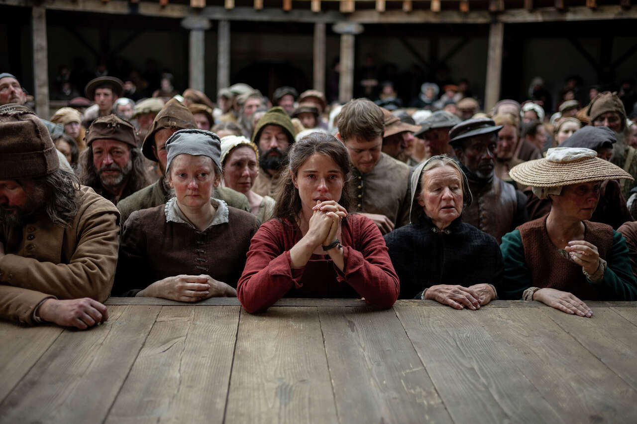 Jessie Buckley, center, in a scene from "Hamnet." (Agata Grzybowska/Associated Press)
