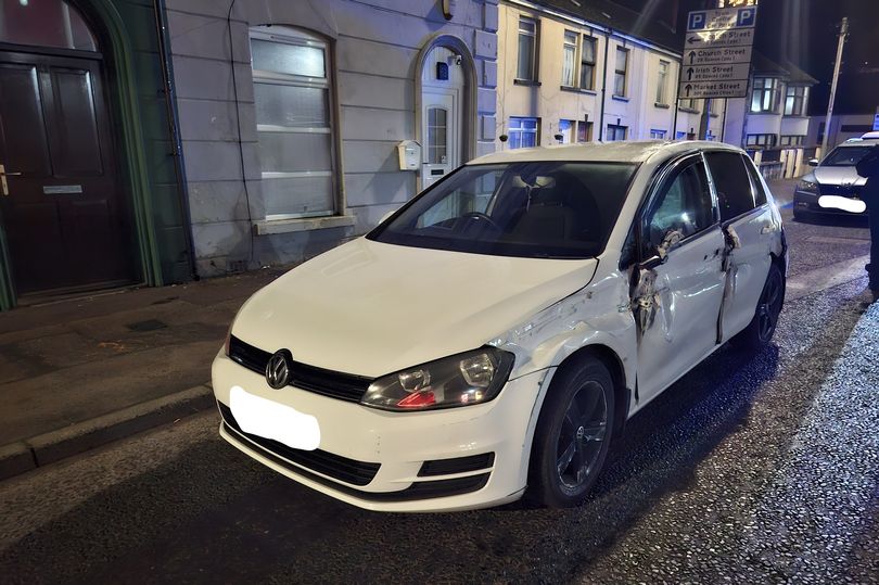 Suspected drunk driver arrested after badly damaged car drives past ...