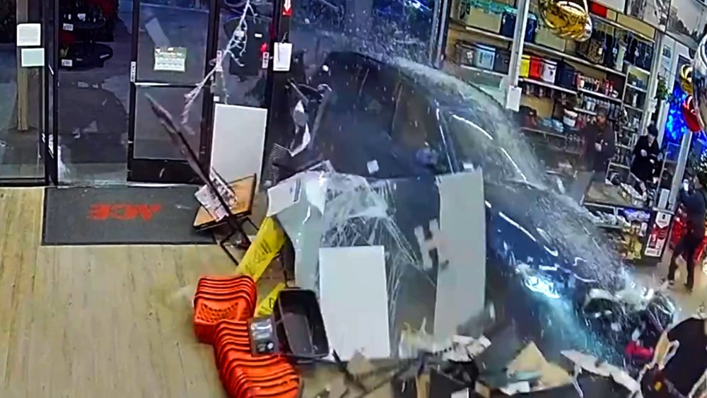 Car plows into California hardware store, causing fire