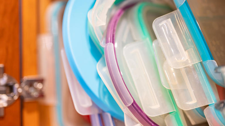 Declutter your kitchen cabinets with a DIY that keeps plastic lids neat ...