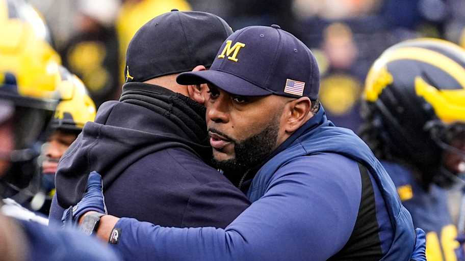 Michigan head coach Sherrone Moore hugs athletic director Warde Manuel during warmup at Michigan Stadium in Ann Arbor on Saturday, Nov. 29, 2025. | Junfu Han / USA TODAY NETWORK via Imagn Images